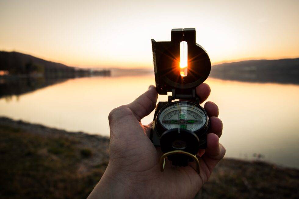 Photo by Tim Graf person showing black and white compass
